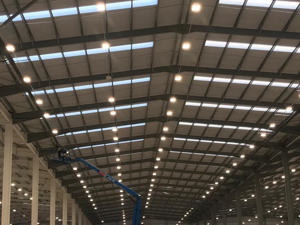 new-build warehouse electrical installation, rows of LED high-bay lights